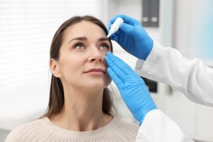 Doctor Applying Eyedrops